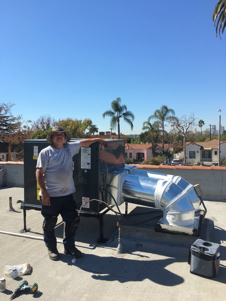 Garcia's Air Conditioning technician on a rooftop HVAC job